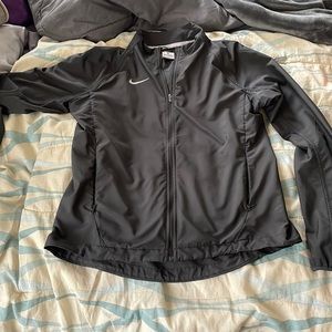 grey nike zip up windbreaker. size m. good condition